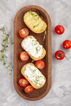 Italian appetizer toasted bread bruschetta with cream chease and tomatoes. Delicious and healthy meal, copy space
