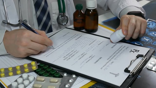 doctor prescribes a medical prescription for the patient