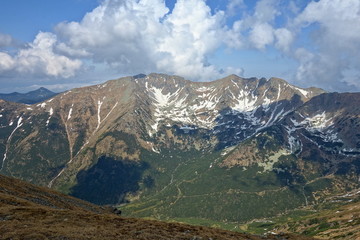 Mountain landscape High Tatras National Park, Žiarska dolina, Slovakia, Europe. Tourists walk in the mountains. Active holiday concept