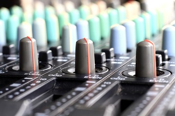 image of music mixing desk in a studio