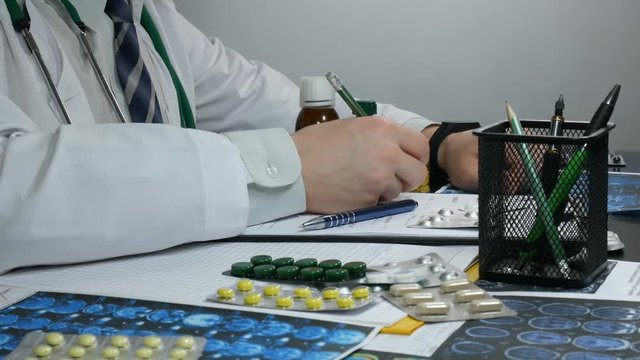 doctor works prescribing medicines for the patient