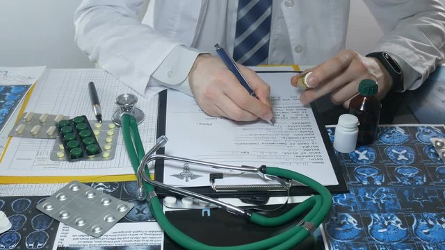 male doctor while working with tablets