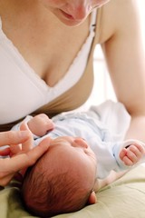 woman feeding baby stock photo