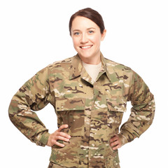 Smiling soldier with hands on hips.