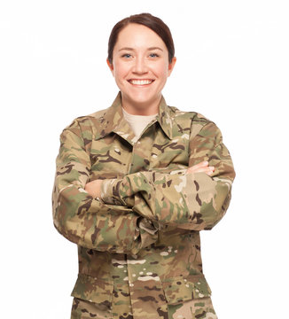 Soldier with arms crossed on white background.