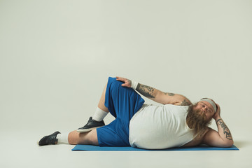 Man relaxing on a yoga mat