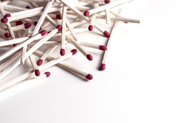 pile of matches on white background, copy space