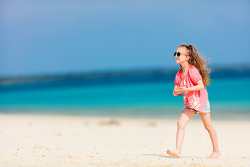 Fototapeta premium Adorable little girl at beach