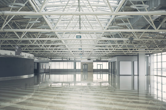 Big bright contemporary empty building with high ceiling reflecting on concrete floor. Design concept