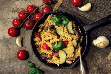 Homemade Pasta Primavera with vegetables on Iron Skillet, overhead view