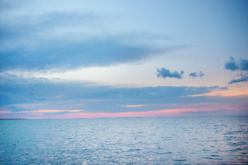 the blue ocean with dull clouds on a lovely sunny day