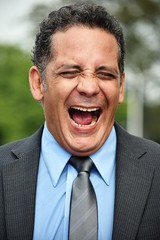 Business Man Laughing Wearing Business Suit
