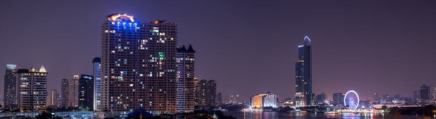 Fototapeta na wymiar panorama night cityscape urban on the river view of metropolis
