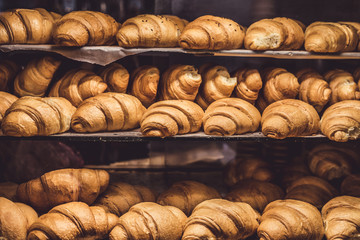 French Croissants on a showcase in a bakery shop