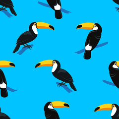Seamless colorful summer pattern with hand drawn toucan birds on bright blue background. Tropical exotic vector illustration 