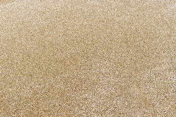 Fototapeta na wymiar Closeup of sand texture pattern of a beach in the summer