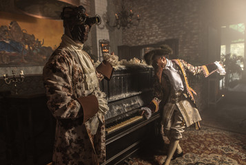 Actors in Steam punk masks and antique costumes indoor.