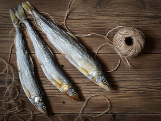 Dried fish on wooden boards