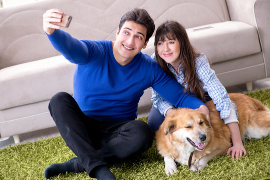 Happy family with golden retriever dog