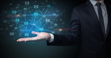 Elegant businessman holding communication concept on his hand 