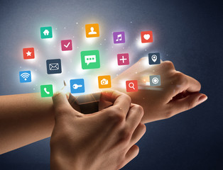 Naked female hand with smartwatch and  application labels around and dark background