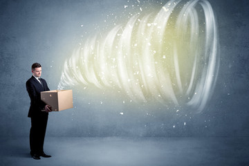 An illustrated powerful whirlwind escaping, coming out of empty paper box held by elegant...