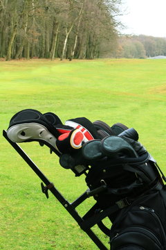 golf clubs with green background
