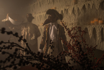 Actors in Steam punk masks and antique costumes indoor.