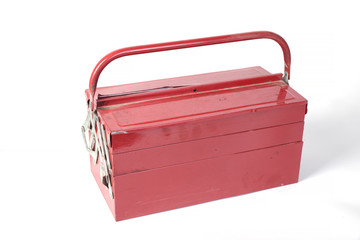 old dirty red box with tools on white background isolated
