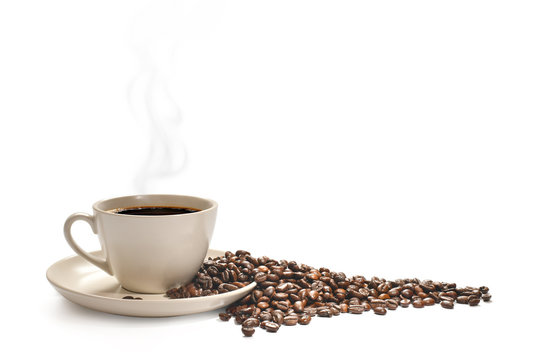 Fototapeta  Cup of coffee with smoke and coffee beans isolated on white