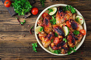 Chicken wings of barbecue in sweetly sour sauce. Picnic. Summer menu. Tasty food. Top view. Flat lay