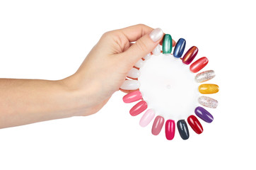 Palette of nail polish with hand, isolated on white background