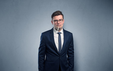 Young tired businessman with thermometer and copy space
