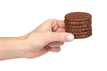 Chocolate cookies with cream with hand isolated on white background