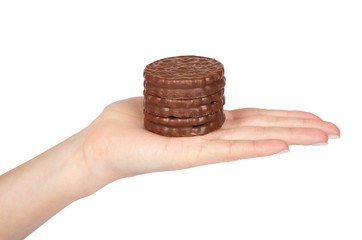 Chocolate cookies with cream with hand isolated on white background