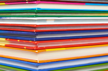 Different colorfull books in stack background image