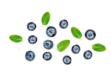 Blueberries  with leaves  isolated on white background, top view Creative ornament with berry fruits, tip view.