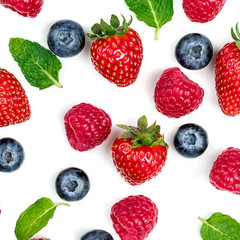 Creative pattern with various fresh berries isolated on white background, top view. 