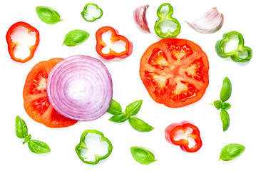 Creative layout with  Fresh vegetables, herbs and spices isolated on white background. Food pattern with red pepper, onion, tomatoes and basil leaves. Top view.