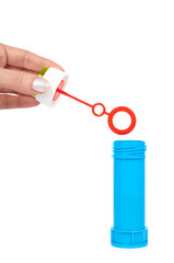 Blue soap bubble bottle with hand isolated on white background