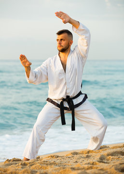 Sportsman is exercising to doing the Shiko-dachi stance