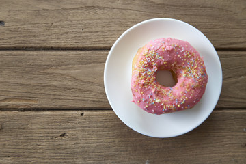 pink donut on a plate