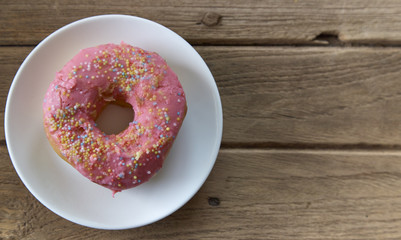 pink donut on a plate