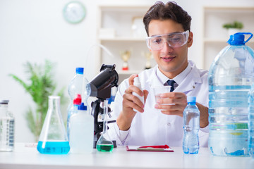 Lab assistant testing water quality