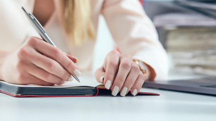 Young Caucasian business woman with headache isolated on white b