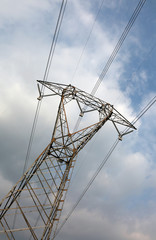 high voltage pylon with very long electric wires purposely incli