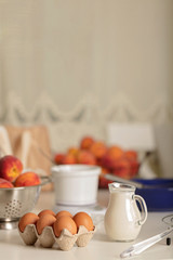 Preparation of homemade peach pie. Kitchen accessories and products.