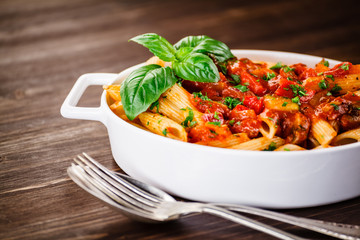Penne with meat, tomato sauce and vegetables