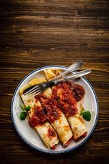 Pancakes with cream and strawberries