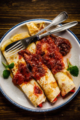 Pancakes with cream and strawberries